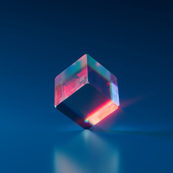 Current NFT: An iridescent cube balanced on its corner with a blue backdrop.